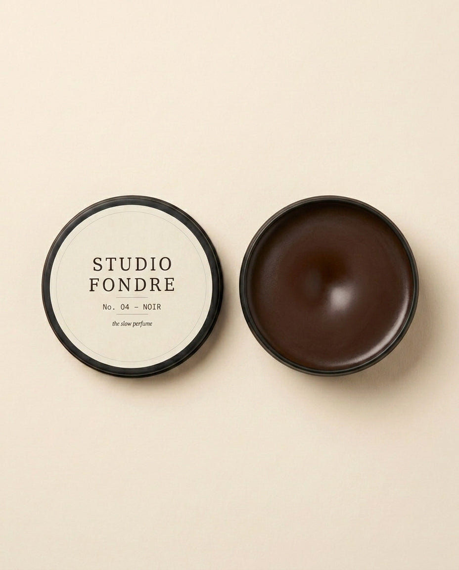 Studio Fondre No. 04 NOIR open showing dark espresso wax interior