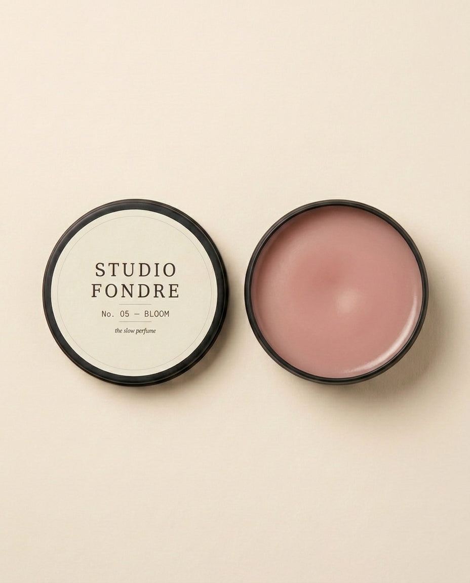 Studio Fondre No. 05 BLOOM open showing soft blush-rose wax interior